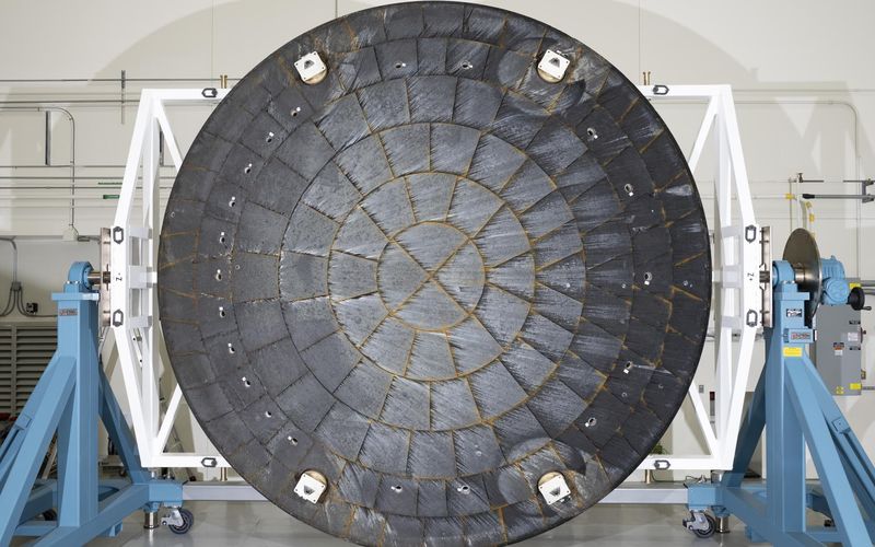 The Artemis II Orion heat shield on inspection stands at NASA Kennedy — NASA