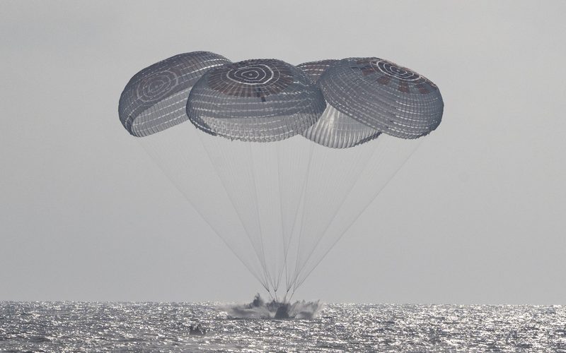 Crew Dragon Freedom under four parachutes splashing down in the Pacific off Los Angeles, Oct. 8, 2026 — NASA/Keegan Barber