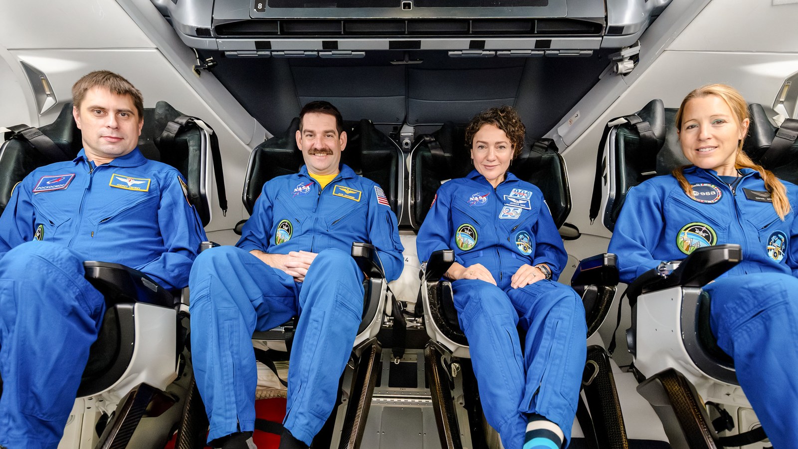 Official Crew-12 portrait inside a SpaceX Dragon: from left, Roscosmos cosmonaut Andrey Fedyaev, NASA astronauts Jack Hathaway and Jessica Meir, and ESA astronaut Sophie Adenot in pressure suits