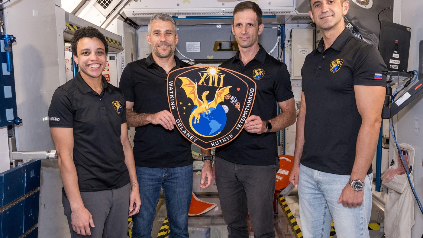 Crew-13 astronauts Watkins, Delaney, Kutryk, and Teteryatnikov with their mission plaque