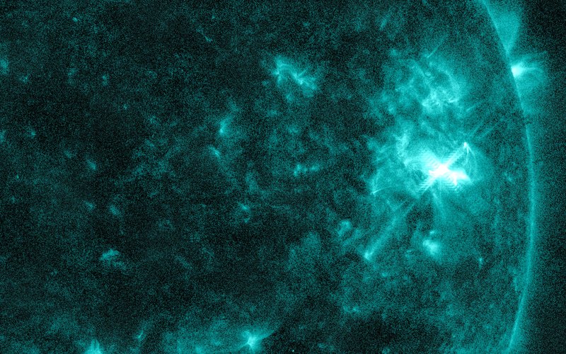 Close-up of the Sun in teal extreme-ultraviolet light with a bright M6.4 flare in Region 4549 — NASA/SDO AIA 131, Oct. 10, 2026