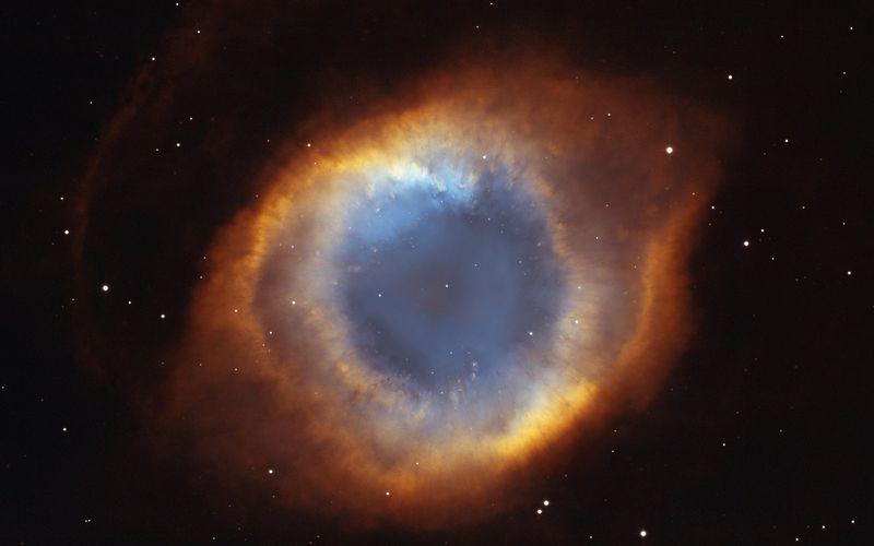 The Helix Nebula, a glowing ring of gas around a white dwarf — NASA/STScI