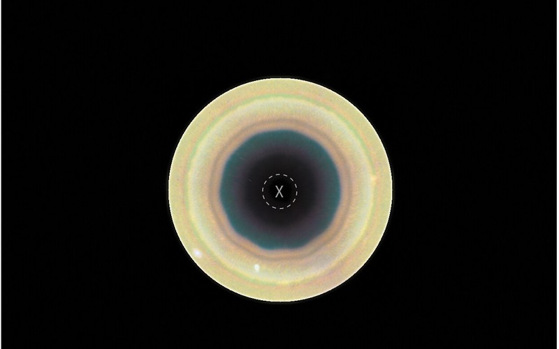 Colour polar view of Saturn’s south pole showing a labeled 10-sided atmospheric wave (decagon)