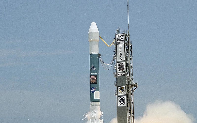 Rocket launch against blue sky