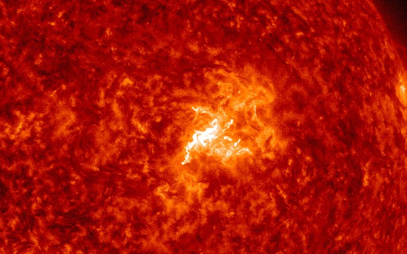 Close-up of the Sun in red extreme-ultraviolet light with a bright M6.7 flare in Region 4549 — NASA/SDO AIA 304, Oct. 8, 2026