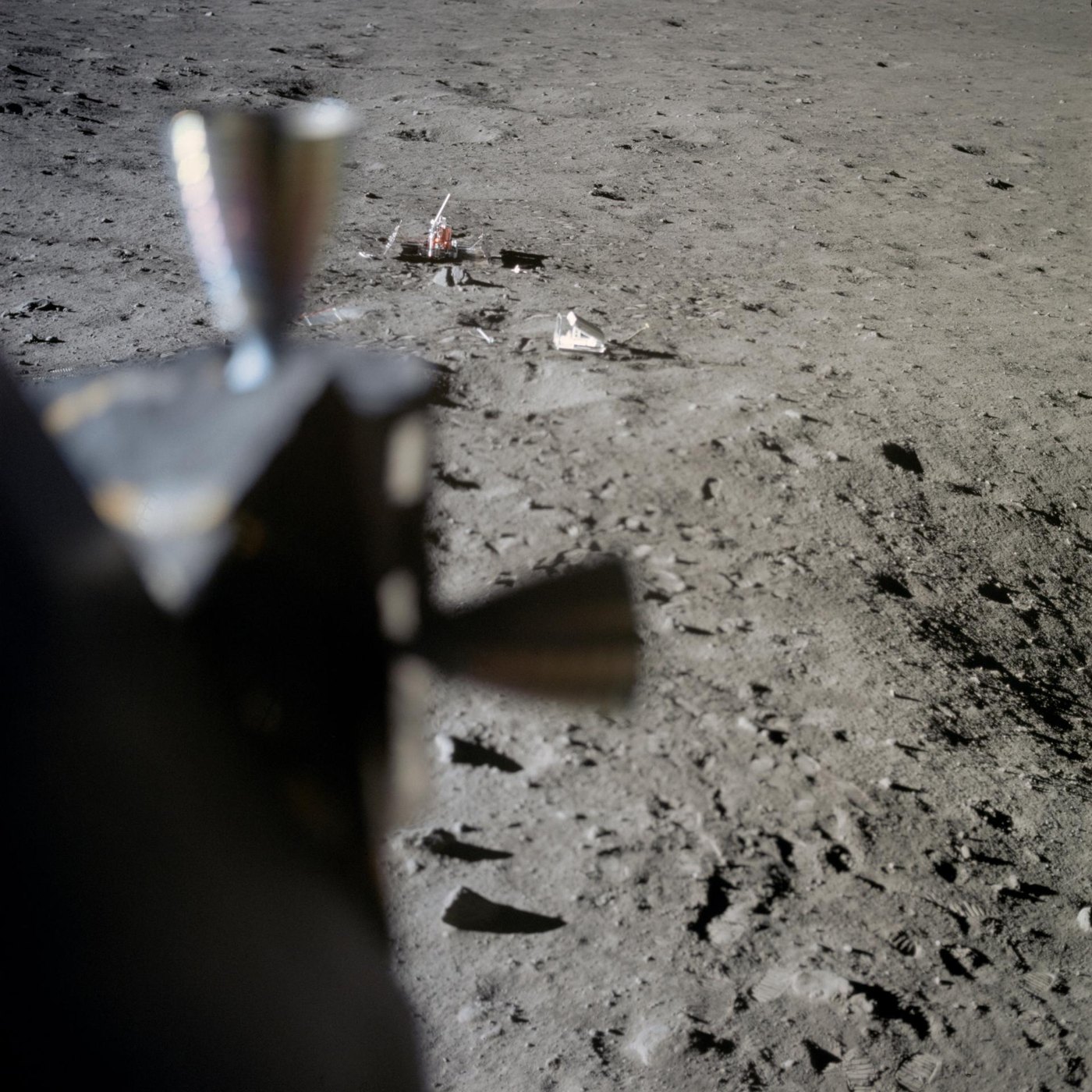 Apollo 11 lunar surface view from inside the Lunar Module showing the Laser Ranging Retro-Reflector, the seismometer and astronaut footprints in the lunar soil