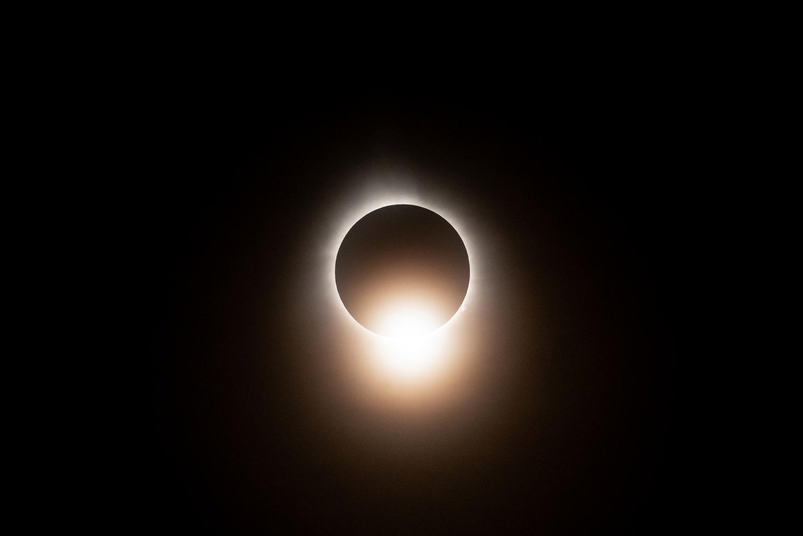 Total solar eclipse of April 8, 2024: the black disk of the Moon covering the Sun, with the Sun’s corona glowing around it