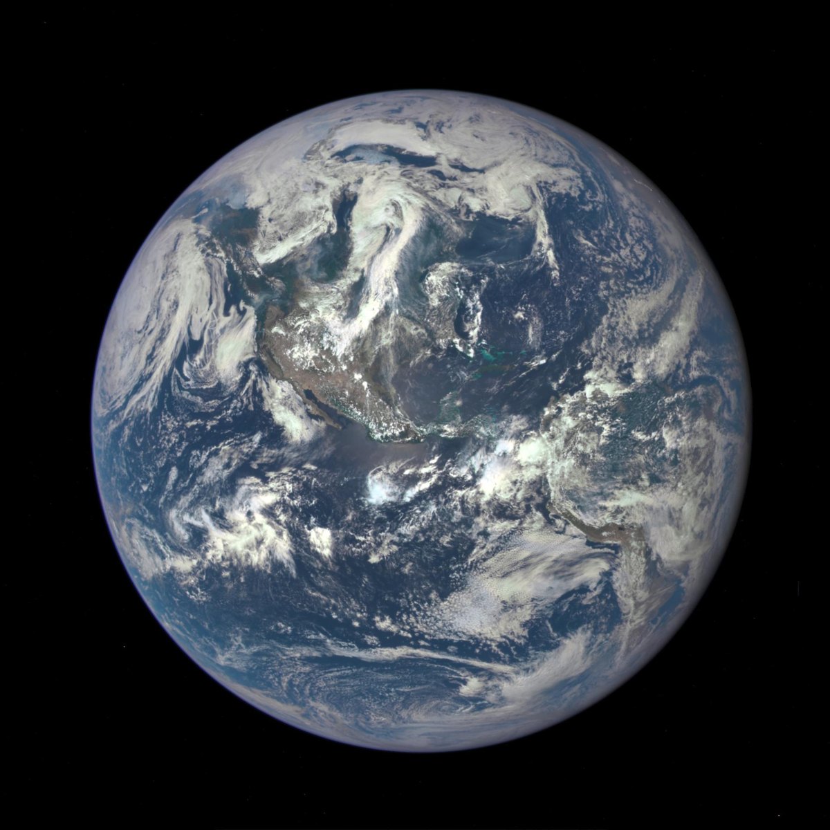 Earth as a full sunlit disk seen from one million miles away, with North and Central America visible