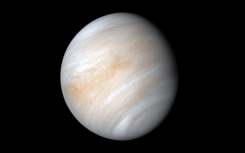 Venus wrapped in pale cream and tan clouds, seen by NASA’s Mariner 10 in 1974 — NASA/JPL-Caltech